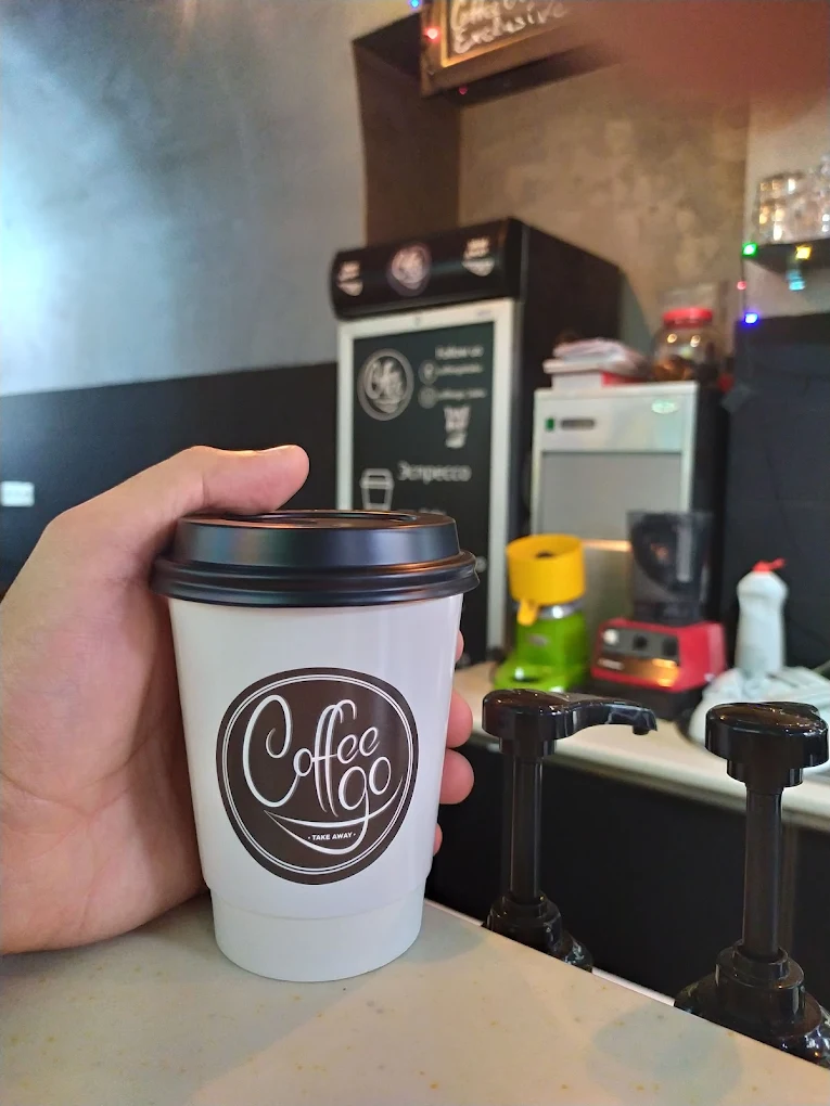 coffe cup at coffego holed by hand